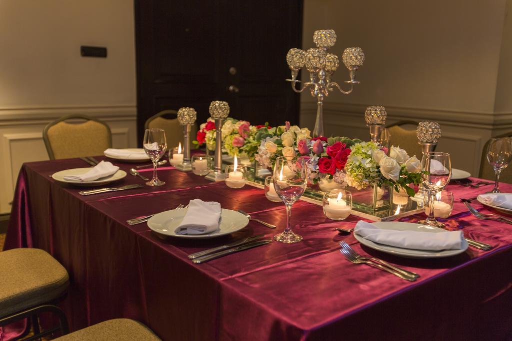 Clarion Suites Guatemala City Exterior photo A table set for a formal dinner
